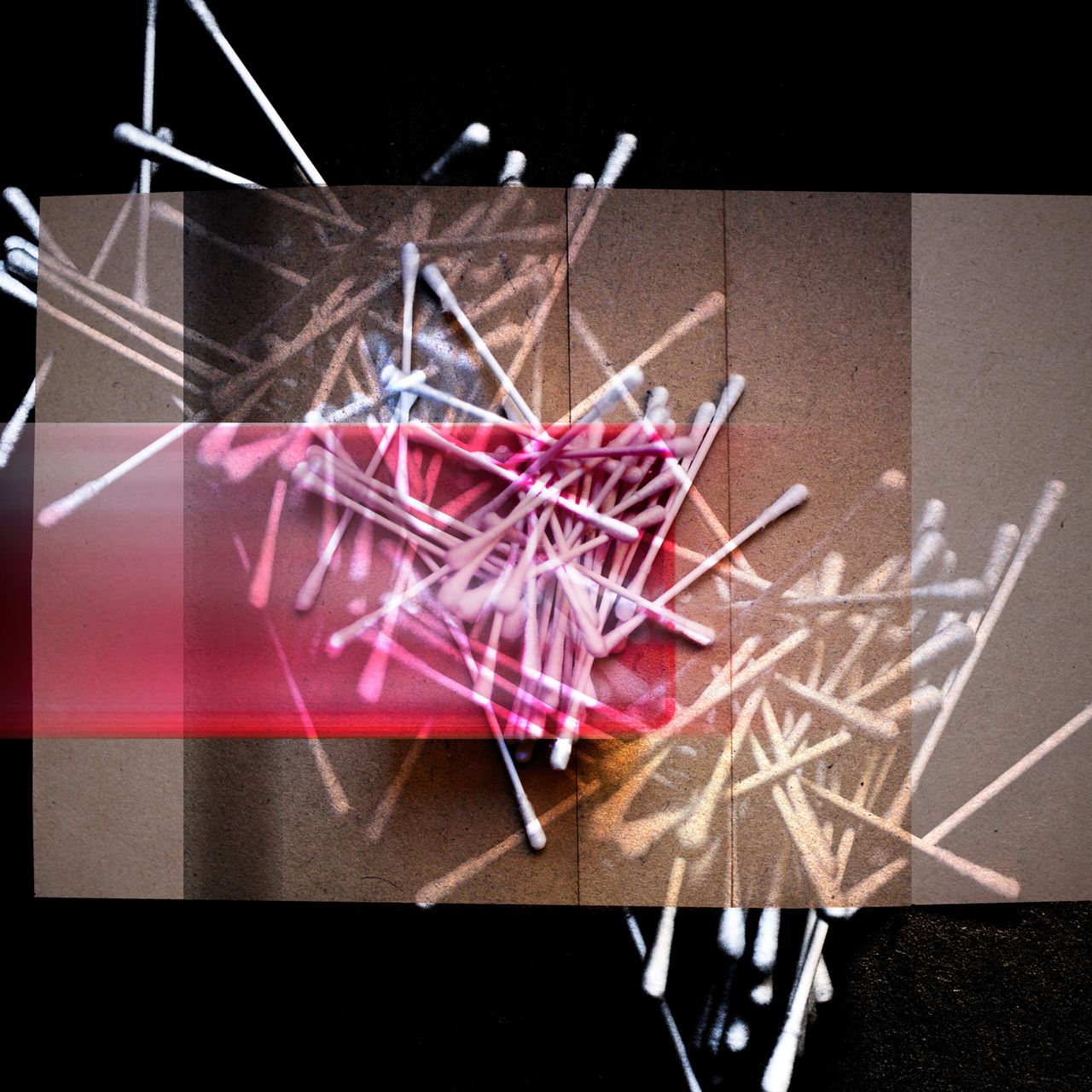 Earbuds, threwn on black and golden brown.