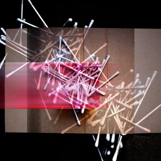 Earbuds, threwn on black and golden brown.