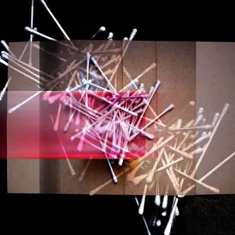 Earbuds, threwn on black and golden brown.